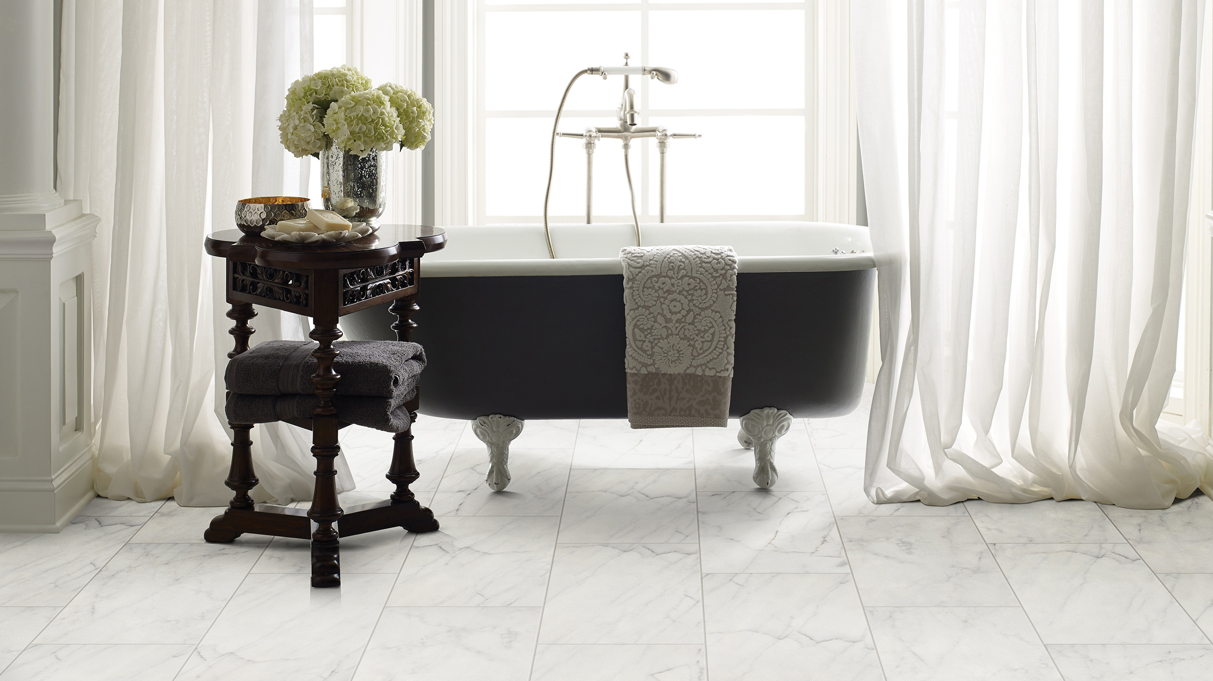 Tile flooring in a bathroom, installation services available.